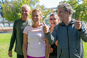 happy excited sporty mature people standing together